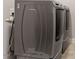 Modern laundry room featuring gray, front-loading washer and dryer set at 1508 Banks Brooke Dr, Raleigh, NC 27603