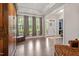 Bright living room boasts hardwood floors, tall windows and neutral walls at 1508 Banks Brooke Dr, Raleigh, NC 27603