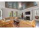 Spacious living room with a striking wooden ceiling, fireplace, and a comfortable sectional sofa at 1508 Banks Brooke Dr, Raleigh, NC 27603
