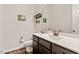 Charming powder room with modern sink, vanity, and neutral colored walls at 1508 Banks Brooke Dr, Raleigh, NC 27603