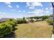 Large open green backyard with fence and lush landscaping at 1533 Santa Lucia St, Wake Forest, NC 27587