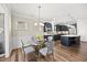 Charming dining area with a glass table and easy access to the modern kitchen at 1533 Santa Lucia St, Wake Forest, NC 27587