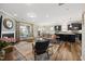 Open living room featuring a fireplace and seamless flow into the kitchen and dining areas at 1533 Santa Lucia St, Wake Forest, NC 27587