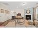 Bright living room with hardwood floors, fireplace, and comfortable seating area at 1533 Santa Lucia St, Wake Forest, NC 27587