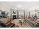 Inviting living room with a cozy fireplace, plush seating, and a stylish area rug at 1533 Santa Lucia St, Wake Forest, NC 27587