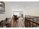 Cozy upstairs living room with hardwood floors, natural lighting and comfortable seating at 1533 Santa Lucia St, Wake Forest, NC 27587
