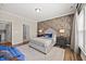 Spacious main bedroom with stylish wall design and hardwood floors, offering a comfortable retreat at 1533 Santa Lucia St, Wake Forest, NC 27587