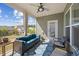 Relaxing screened-in porch with comfortable seating, a ceiling fan, and serene backyard views at 1533 Santa Lucia St, Wake Forest, NC 27587
