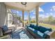 Inviting screened-in porch with comfortable seating, a ceiling fan, and a peaceful backyard view at 1533 Santa Lucia St, Wake Forest, NC 27587