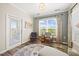 Inviting sitting room featuring a cozy chair, desk, and a large window with scenic views at 1533 Santa Lucia St, Wake Forest, NC 27587