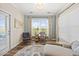 Cozy sitting room with lots of natural light from the large window and a comfortable chair at 1533 Santa Lucia St, Wake Forest, NC 27587
