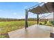 Backyard featuring a covered patio overlooking a spacious yard and a wood fence perimeter at 173 Longbow Dr, Middlesex, NC 27557