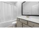 Clean bathroom with a shower-tub combo, a modern mirror, and a stylish vanity at 173 Longbow Dr, Middlesex, NC 27557