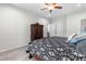 Cozy bedroom featuring a ceiling fan, wardrobe cabinet, and neutral décor for a relaxing retreat at 173 Longbow Dr, Middlesex, NC 27557