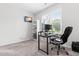 Bright bedroom featuring a built-in bookcase and a dedicated work-from-home station with a TV at 173 Longbow Dr, Middlesex, NC 27557