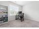 Bright bedroom featuring a built-in bookcase and a dedicated work-from-home station at 173 Longbow Dr, Middlesex, NC 27557
