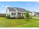 Stylish single-story home with a well-kept lawn, covered porch, and attached carport at 173 Longbow Dr, Middlesex, NC 27557