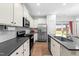 Well-equipped kitchen with stainless steel appliances, ample counter space, and modern white subway tile backsplash at 173 Longbow Dr, Middlesex, NC 27557