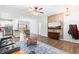 Bright, open-concept living area featuring hardwood floors, modern decor, and a seamless flow to the kitchen at 173 Longbow Dr, Middlesex, NC 27557