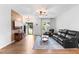 Stylish living room with hardwood floors, comfortable seating, and a decorative accent wall at 173 Longbow Dr, Middlesex, NC 27557