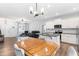Open-concept living space with a kitchen island, dining area, and comfortable seating, perfect for entertaining at 173 Longbow Dr, Middlesex, NC 27557