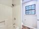 Clean, bright bathroom with a shower and a window providing natural light at 2012 Stadium Dr, Durham, NC 27705