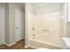 Full bathroom with shower and tub combination, with hard surface floors and a built-in soap dish at 2012 Stadium Dr, Durham, NC 27705