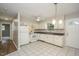 Functional kitchen with white cabinetry, essential appliances, and ample counter space for meal preparation at 2012 Stadium Dr, Durham, NC 27705