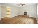 Inviting living room featuring hardwood floors, a fireplace, and a ceiling fan, perfect for relaxation at 2012 Stadium Dr, Durham, NC 27705