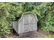 White shed nestled among lush foliage, offering ample storage or workspace at 2012 Stadium Dr, Durham, NC 27705