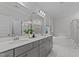 Modern bathroom with double sinks, a tub, a glass shower and white marble tile at 2012 Sweet Samson St, Wake Forest, NC 27587