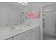 Bright bathroom with a double sink vanity, quartz countertop, and framed mirrors at 2012 Sweet Samson St, Wake Forest, NC 27587