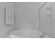 Modern bathroom featuring a soaking tub with a glass shower and marble-like tile at 2012 Sweet Samson St, Wake Forest, NC 27587