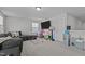 Play area with toys and gray couch in a neutrally decorated bonus room at 2012 Sweet Samson St, Wake Forest, NC 27587