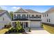 Charming two-story home with a welcoming front porch and attached two-car garage at 2012 Sweet Samson St, Wake Forest, NC 27587