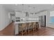 Modern kitchen featuring a large island with seating and stainless steel appliances at 2012 Sweet Samson St, Wake Forest, NC 27587