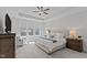 Main bedroom featuring a ceiling fan, large windows, and natural light at 2012 Sweet Samson St, Wake Forest, NC 27587