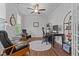 Home office with ceiling fan, hardwood floors, and a desk with black office chair at 2012 Sweet Samson St, Wake Forest, NC 27587