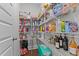 Organized walk-in pantry with white wire shelving stocked with food and beverages at 2012 Sweet Samson St, Wake Forest, NC 27587