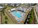 Community pool featuring lounge seating, umbrellas, and nearby covered pavilions at 2012 Sweet Samson St, Wake Forest, NC 27587