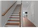 Staircase with wood treads and white risers, leading to the upper level of the home at 2012 Sweet Samson St, Wake Forest, NC 27587