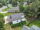 A high angle shot reveals a back yard with garden and tiered landscaping, plus a small deck at 202 Homestead Park Dr, Apex, NC 27502