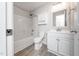 Well-maintained bathroom featuring a shower-tub combo, a vanity with cabinet, and wood-look tile floors at 202 Homestead Park Dr, Apex, NC 27502