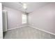 Comfortable bedroom features plush carpeting, a ceiling fan, and a window at 202 Homestead Park Dr, Apex, NC 27502