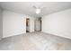 A spacious bedroom includes plush carpeting, ceiling fan, and easy access to a full ensuite bathroom at 202 Homestead Park Dr, Apex, NC 27502
