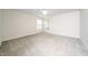 Bright, carpeted bedroom with a ceiling fan and windows offering natural light at 202 Homestead Park Dr, Apex, NC 27502