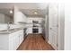 Well-equipped kitchen featuring stainless steel appliances and a view to the living area at 202 Homestead Park Dr, Apex, NC 27502