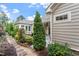 Beautiful backyard and patio surrounded by manicured landscaping at 228 Ellisview Dr, Cary, NC 27519