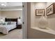 Calming main bedroom with a tray ceiling, neutral walls, and a comfortable queen-size bed at 228 Ellisview Dr, Cary, NC 27519