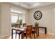 Inviting dining room with wood table and chairs near sliding glass doors to the outside porch and patio at 228 Ellisview Dr, Cary, NC 27519